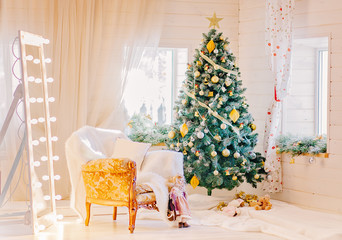 Light holdiay decorated room with Christmas tree. New Year decor.