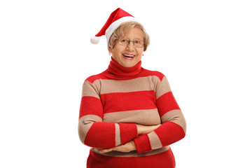 Cheerful mature lady with Christmas hat posing with her arms cro