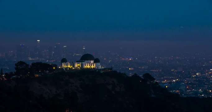 Los Angeles, California, USA - view of illuminated Griffith Observatory and City of Los Angeles facing south at sunset - Timelapse without motion