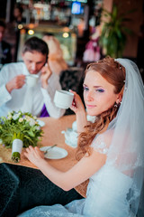 Happy bride and groom in vintage interior of resrourant