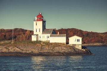 Fototapeta na wymiar Tyrhaug Lighthouse. Coastal tower, old style