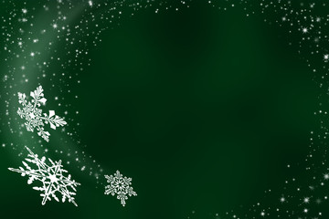 Fototapeta na wymiar Flying snowflakes on green background - abstract