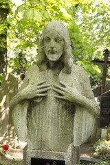 Historic Jesus on the mystery old Prague Cemetery, Czech Republic
