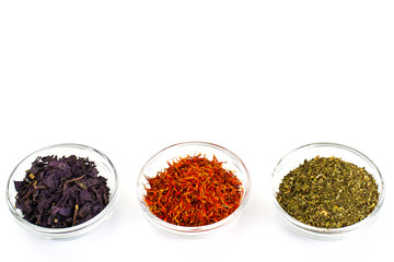 Basil, Saffron, Mint in a Glass Bowl on a White