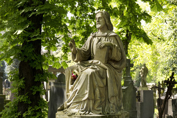 Historic Jesus on the mystery old Prague Cemetery, Czech Republic