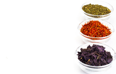 Basil, Saffron, Mint in a Glass Bowl on a White