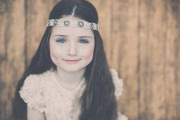 Close-up portrait of a beautiful girl with hairband, vintage eff
