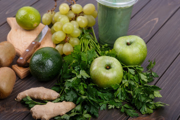 healthy smoothie with green vegetables and fruit lie on the tabl