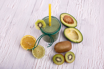 healthy smoothie with grape,avocado and kiwi lie on the table