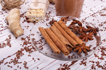 brown cinnamon sticks and grain clove lie on the table