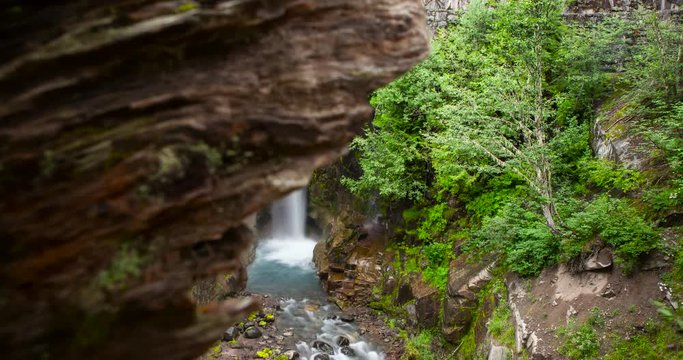 Mount Rainier National Park, Washington, USA - Christine Falls with famous stonebridge at forest - Timelapse with motion 