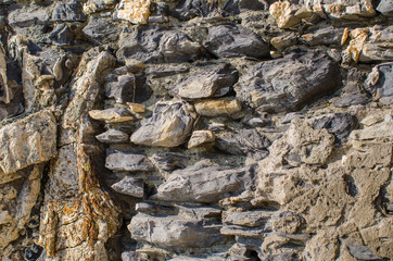 Background of old stone and rocks on a sunny day