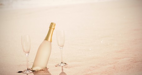 Champagne flutes with bottle on sand at beach © vectorfusionart