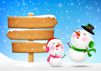 Christmas Snowman and snowgirl and wooden sign blank board and w © Kaikoro