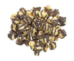 Fudge drizzled popcorn on a white background.