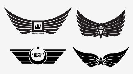 Set of four vector logo wings. Winged decors with crown, star fo