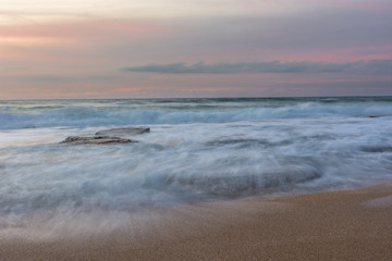 silky water of a rough sea after sunset