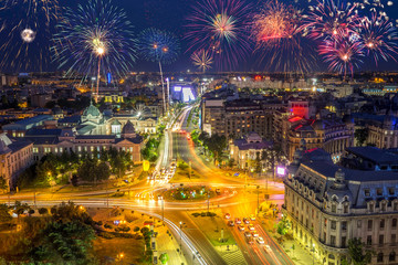 Fototapeta na wymiar University Square in Bucharest Romania with fireworks in the sky