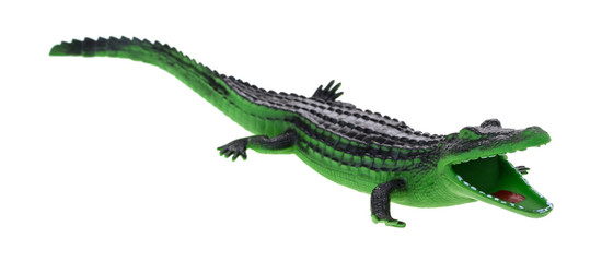 Toy alligator with open mouth isolated on a white background.