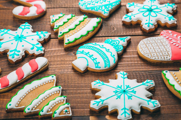 Homemade delicious Christmas gingerbread cookies on the wooden background