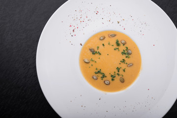 pumpkin soup in white plate