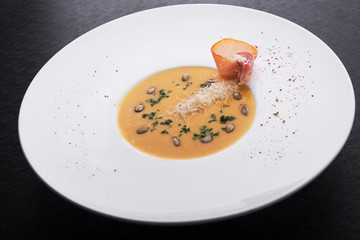 pumpkin soup in white plate