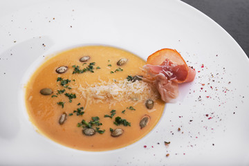 pumpkin soup in white plate