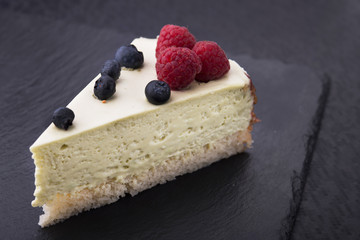 tasty piece of cake on stone slate