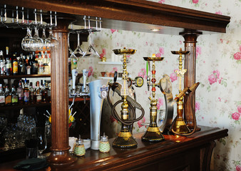 The bar in the restaurant. Draught beer, hookah, alcohol showcases