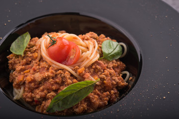 pasta tagliatelle with meat, tomato and basil