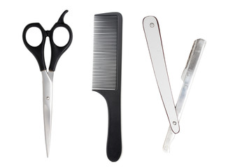 Comb with scissors and razor on a white background