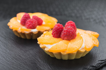 tasty fruit tartlet with raspberries