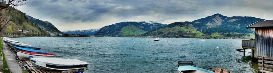 Fototapeta na wymiar Lake panorama in alps with boat