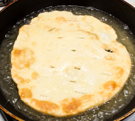 tortilla is fried in a pan