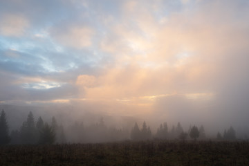 Fototapeta na wymiar Autumn Landscape with fog in mountains