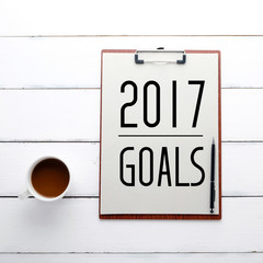 2017 goals on on clipboard over white wood background