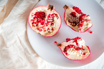 Sliced pomegranate on white background