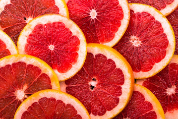 Macro of grapefruit slices, texture of citrus, close up, overhead view