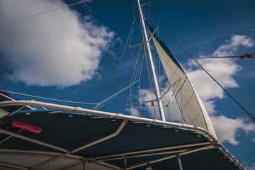 Fototapeta premium catamaran view from a low angle with background of sky and clouds