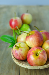 Red and yellow apple   on wooden background