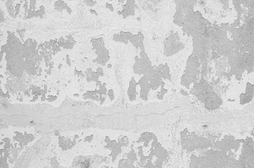 Closeup pale color and peeling of painted green cement wall textured background in black and white tone