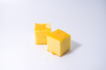 square butter cake on white background. square butter cake stack. butter cake on white.
