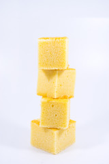 square butter cake on white background. square butter cake stack. butter cake on white.