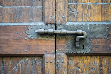 Details of an ancient Italian door in Florence, Italy.
