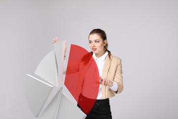 Woman shows a pie chart, circle diagram. Business analytics concept.
