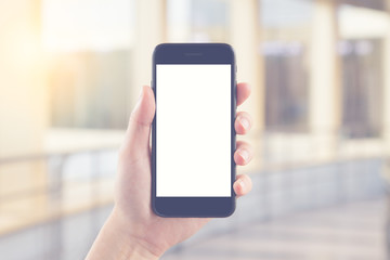 Woman hand hold black smartphone blank white screen for advertising display and other design