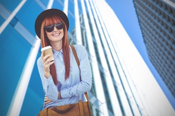 Composite image of smiling hipster woman drinking coffee