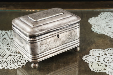 Silver casket, jewelry/trinket box on retro table