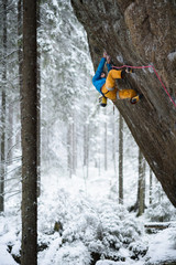 Climbing, winter, snow, enjoying extreme winter sport. Extreme activity.