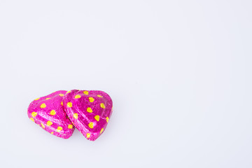 Chocolate or red heart shape chocolate on a background.